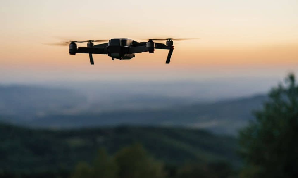drone lidar mapping over rural landscape - ALTA SURVEY Tennessee Drone flying over rural hills collecting LiDAR mapping data for elevation-based property planning