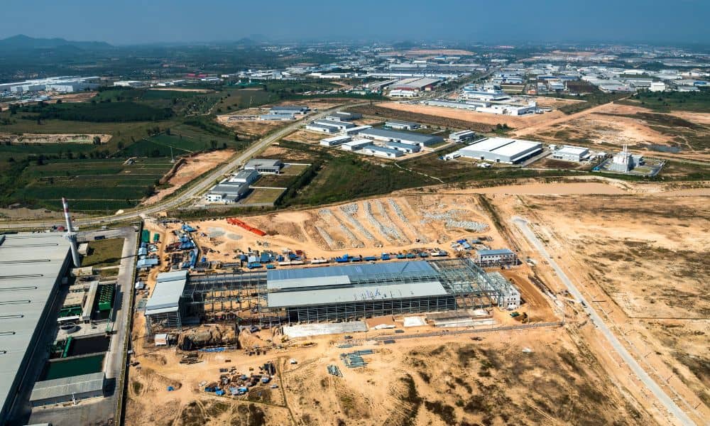 Early-stage industrial site showing land development engineering and site preparation before construction