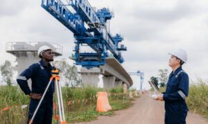Engineers performing a structural engineer inspection on a bridge to evaluate safety