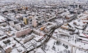 Aerial view of a city during a winter storm showing how survey mapping supports emergency response