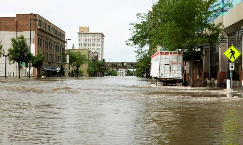 Urban street flooding after heavy rain, showing why an environmental engineer plays a critical role in stormwater management