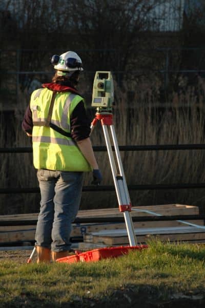 Surveyor using equipment - ALTA SURVEY Tennessee Surveyor using equipment to mark property boundaries for a land survey for fence project